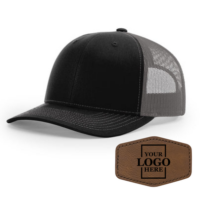 Realtor branded black and charcoal trucker snapback hat with a dark brown hex patch with black engraving