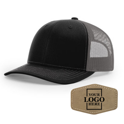 Realtor branded black and charcoal trucker snapback hat with a light brown  hex patch with black engraving