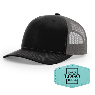 Realtor branded black and charcoal trucker snapback hat with a teal hex patch with black engraving