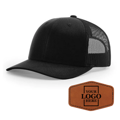 Realtor branded black trucker snapback hat with a rawhide hex patch with black engraving