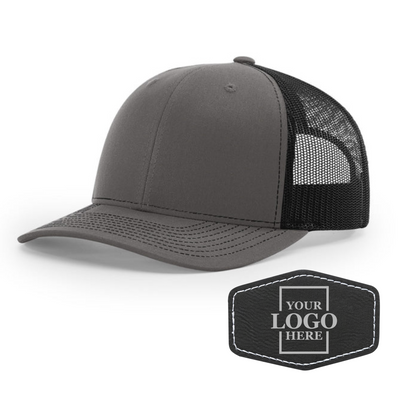 Realtor branded charcoal and black trucker snapback hat with a black hex patch with silver engraving