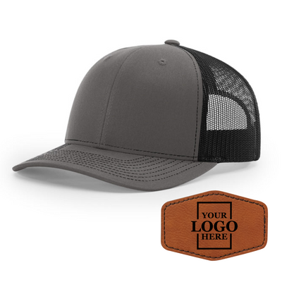 Realtor branded charcoal and black trucker snapback hat with a rawhide hex patch with black engraving
