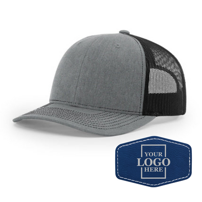 Realtor branded gray and black trucker snapback hat with a blue hex patch with silver engraving