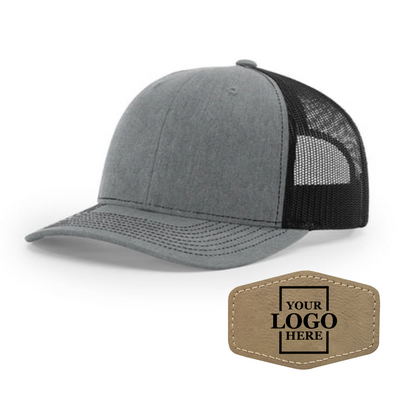 Realtor branded gray and black trucker snapback hat with a light brown hex patch with black engraving