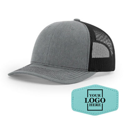 Realtor branded gray and black trucker snapback hat with a teal hex patch with black engraving