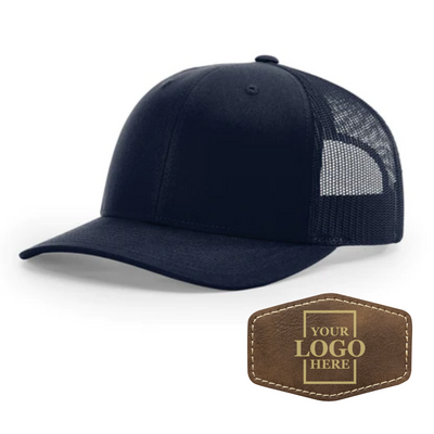 Realtor branded navy trucker snapback hat with a rustic hex patch with gold engraving