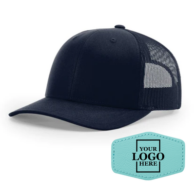 Realtor branded navy trucker snapback hat with a teal hex patch with black engraving