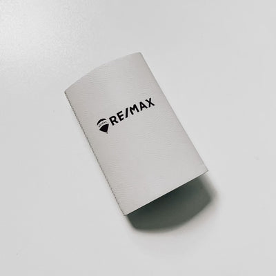 Realtor branded leatherette koozie in white with black engraving