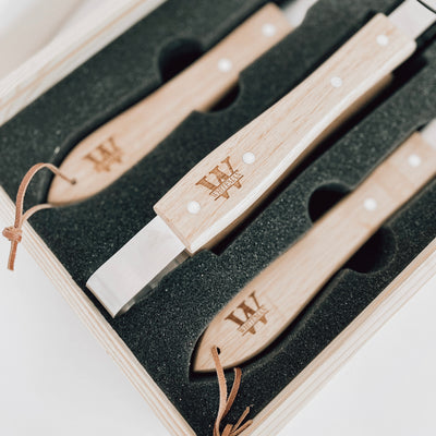 Real estate gift of grill set showing the inside with the tools engraved in split monogram design with last name