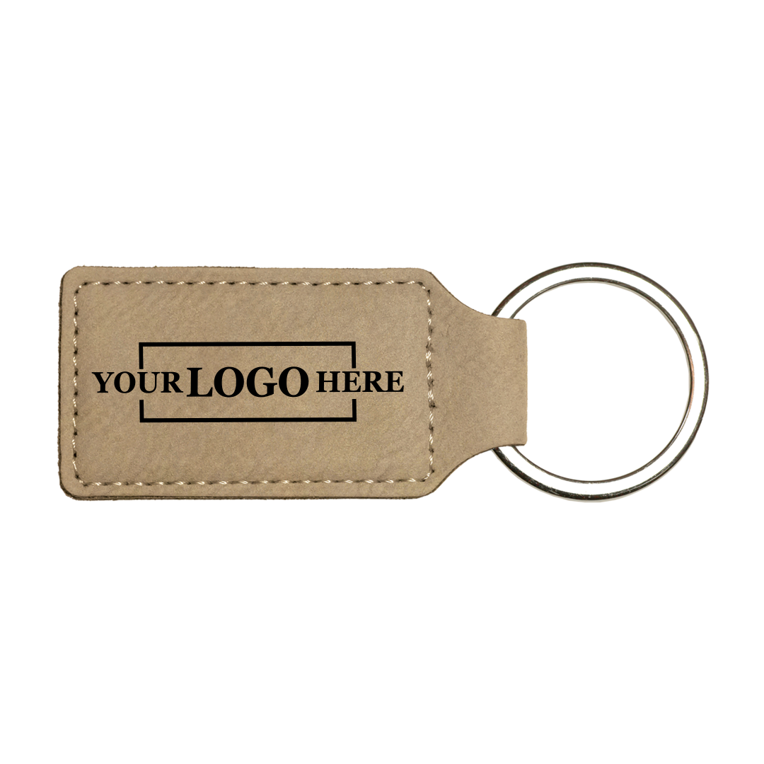 Realtor promotional light brown branded leatherette keychains with black engraving, shown horizontally
