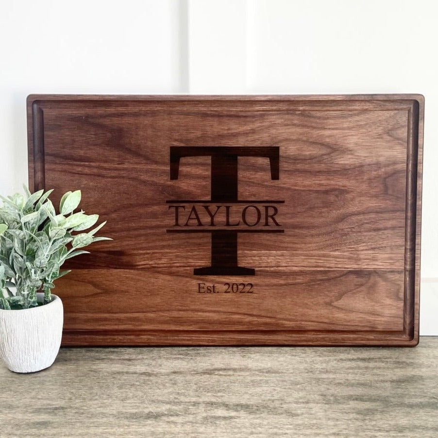 Real estate gift of a large walnut rectangle cutting board 