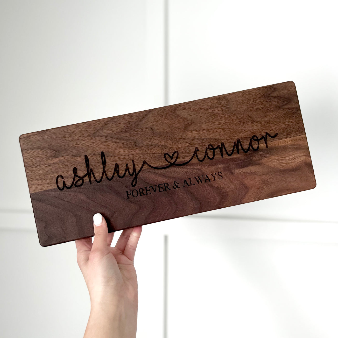 Real estate gift of a long rectangle cutting board in walnut 