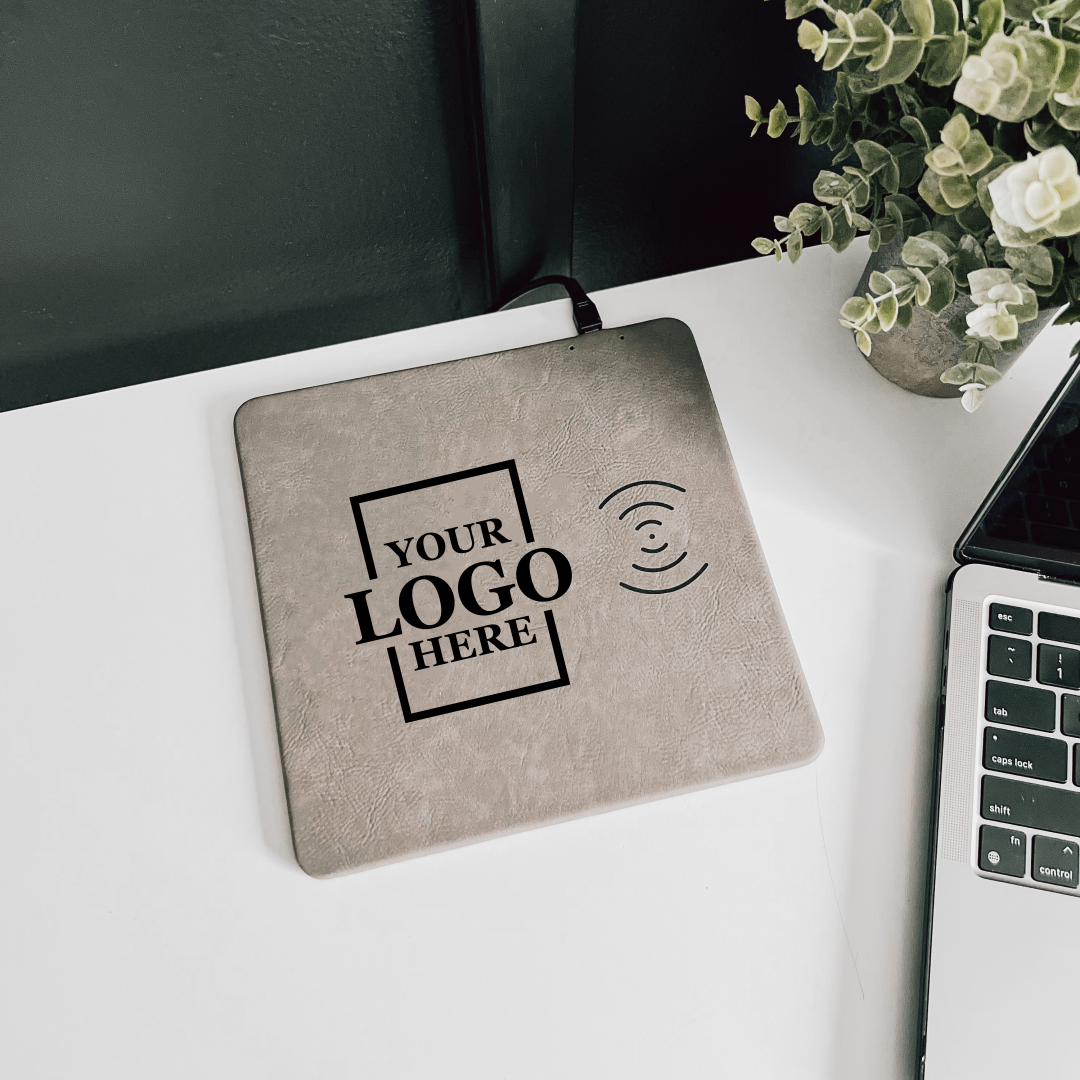 Real estate promotional gift of custom branded gray leatherette mouse pad engraved in black