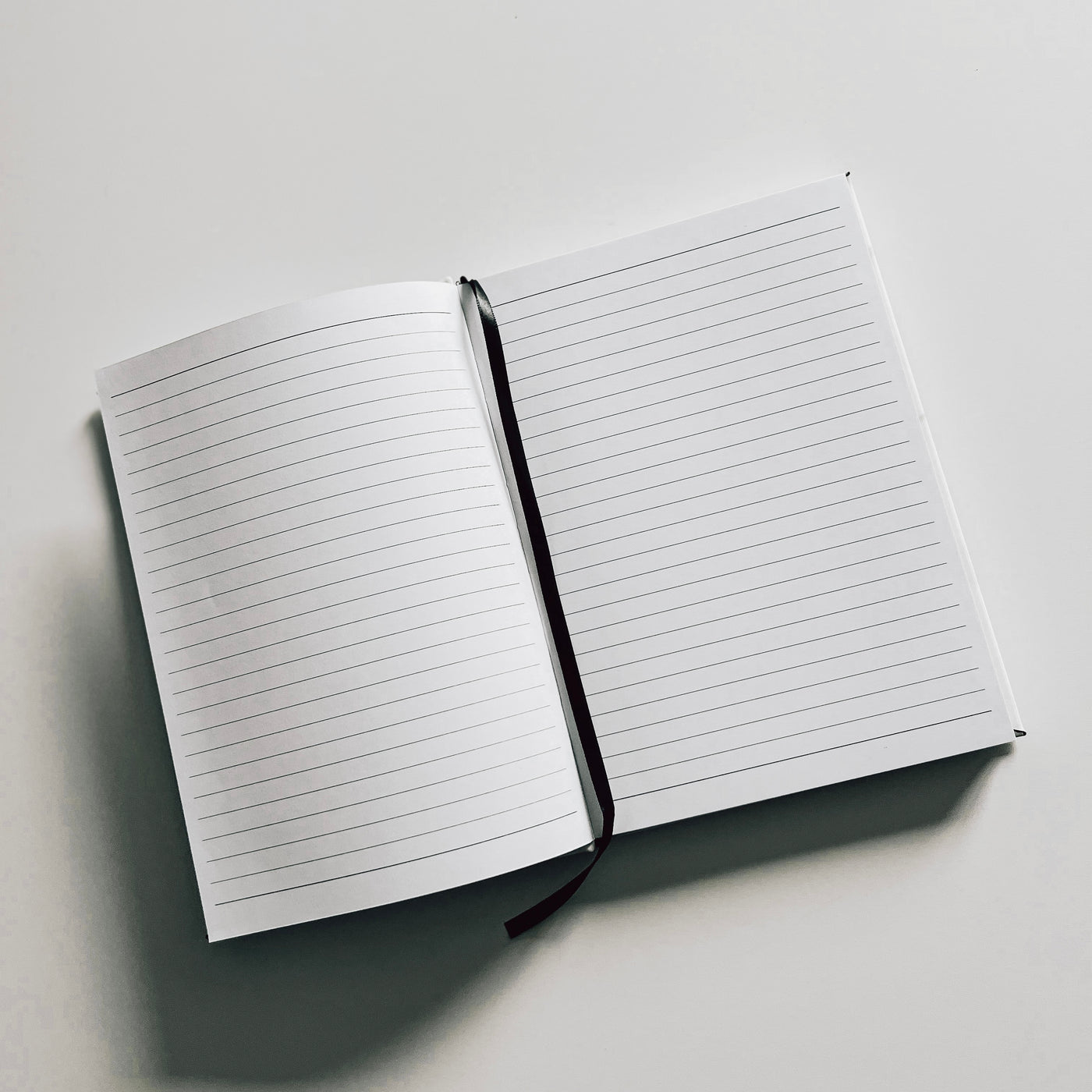 Real estate promotional gift of a marble leatherette notepad showing inside of notepad