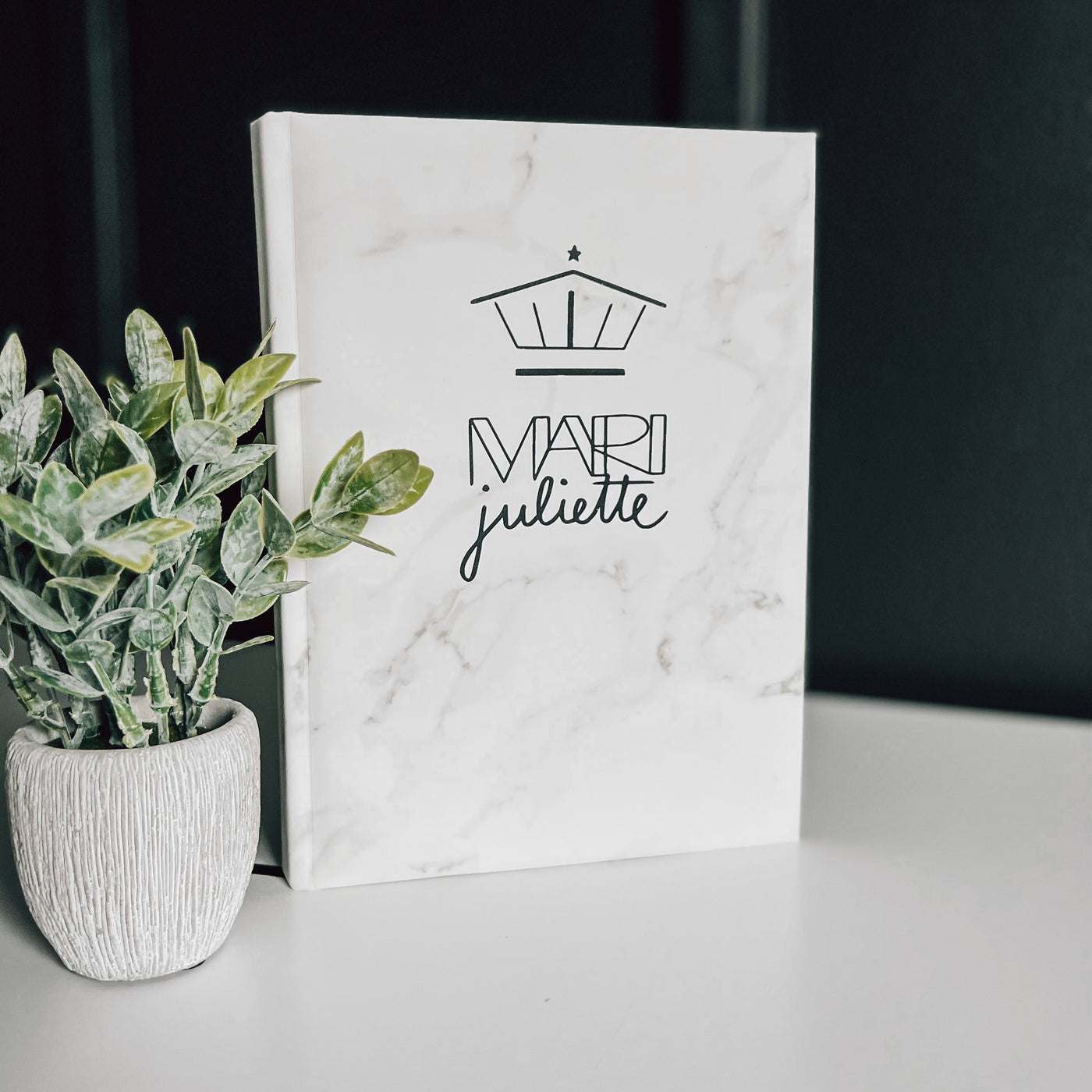 Real estate promotional gift of a marble leatherette notepad engraved with black 