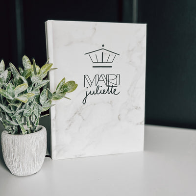 Real estate promotional gift of a marble leatherette notepad engraved with black 