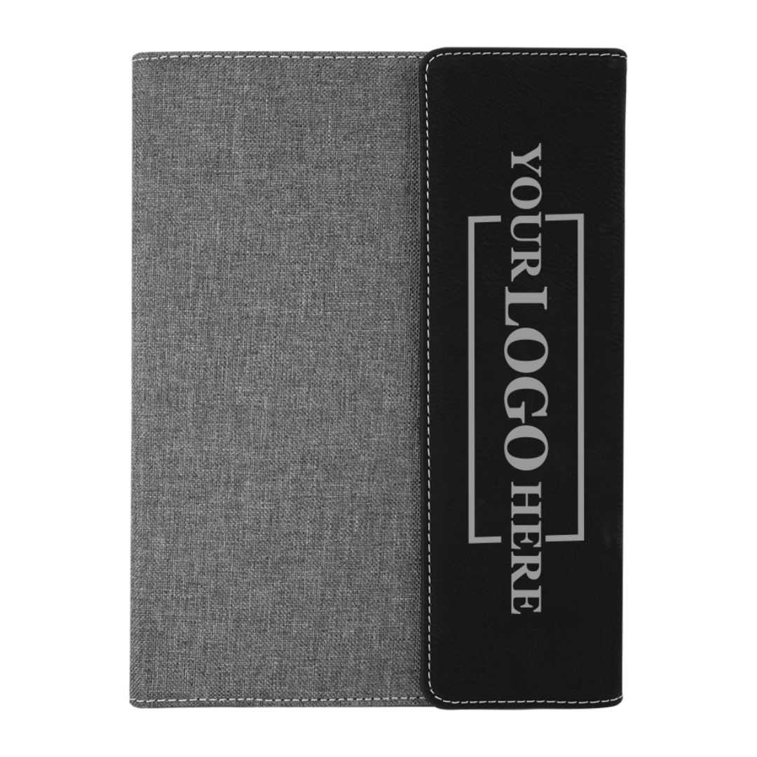 Real estate promotional gift of black and gray leatherette and canvas portfolio with notepad engraved with black