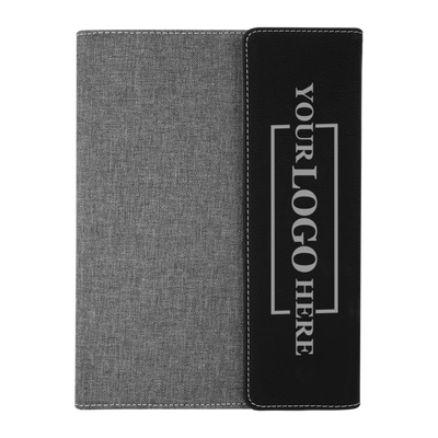 Real estate promotional gift of black and gray leatherette and canvas portfolio with notepad engraved with black