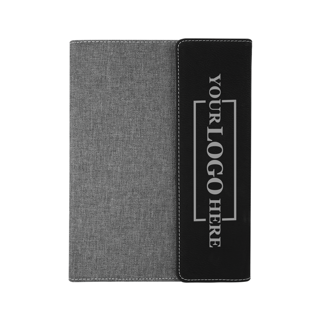 Real estate promotional gift of a gray and black leatherette portfolio with notepad engraved with silver