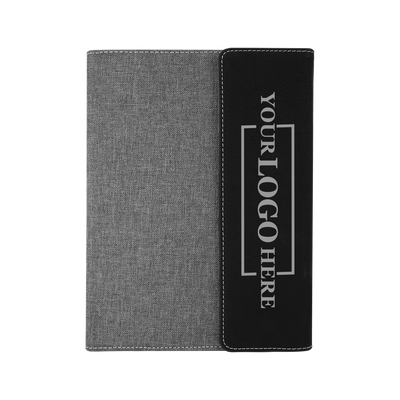 Real estate promotional gift of a gray and black leatherette portfolio with notepad engraved with silver