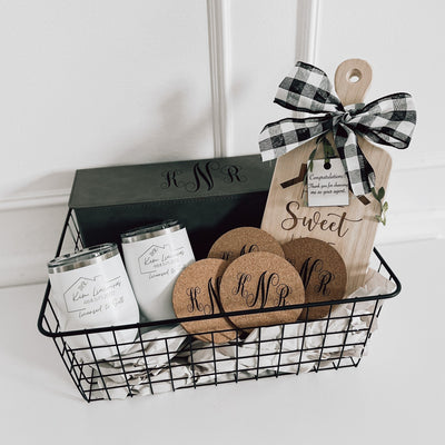 Real estate gift of the wine lovers gift basket including a custom engraved wine box, a small rubber wood board, cork coasters and 2 12 oz wine tumblers