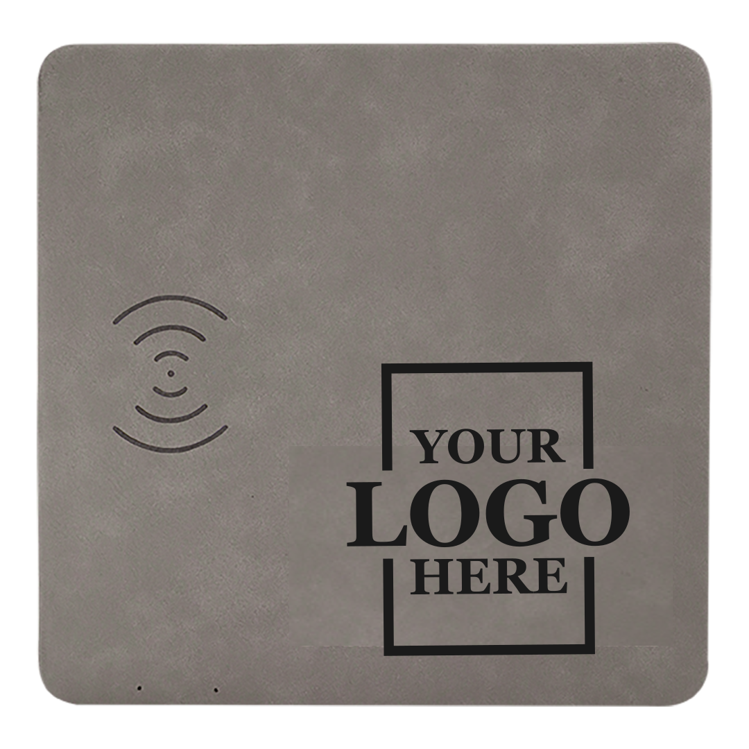 Real estate promotional gift of a gray branded leatherette wireless charging mat engraved in black 