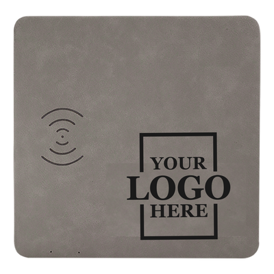 Real estate promotional gift of a gray branded leatherette wireless charging mat engraved in black 