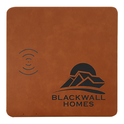 Real estate promotional gift of a rawhide branded leatherette wireless charging mat engraved in black 
