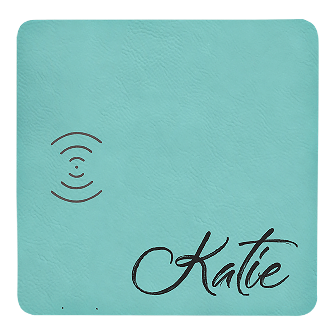 Real estate promotional gift of a teal branded leatherette wireless charging mat engraved in black 
